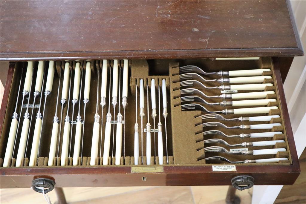 A Mappin & Webb part service of plated flatware in mahogany table canteen